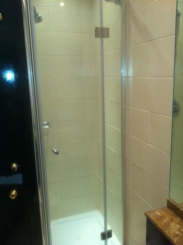 Frameless glass shower enclosure with chrome fittings in Alexandra Palace