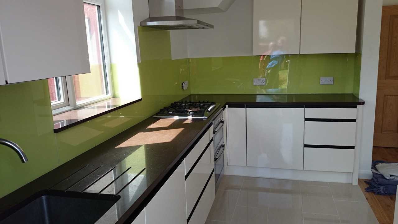 Lime green glass kitchen splashback installed by Alexandra Palace glaziers